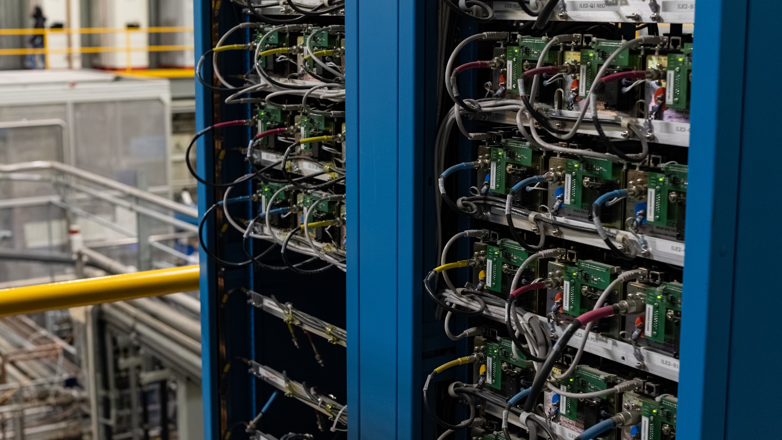 Electronic equipment racks filled with components and multicolored cables.
