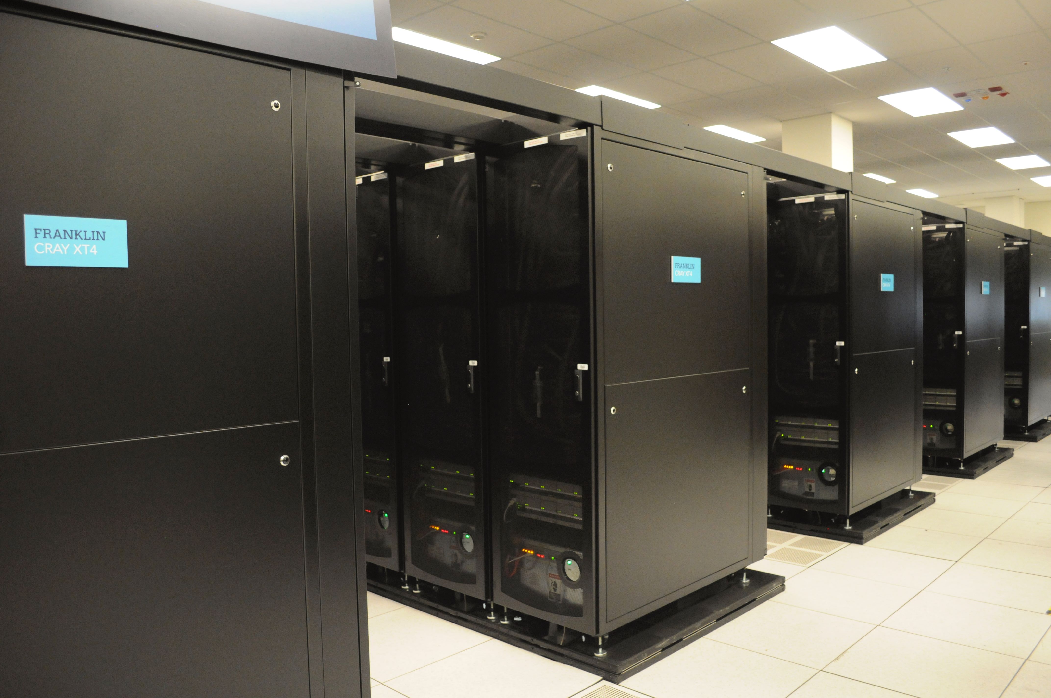 Rows of high-performance computing racks in a data center.