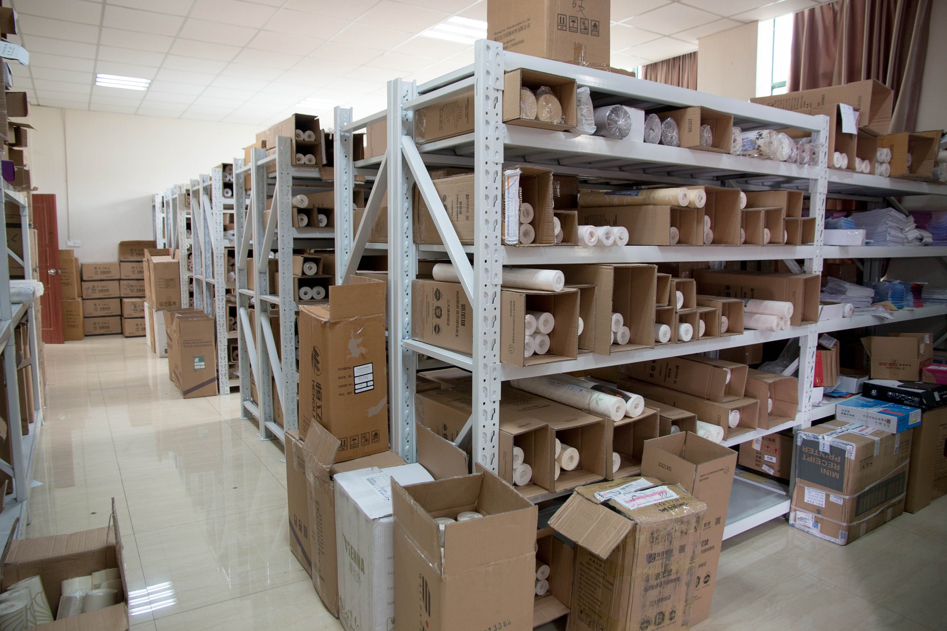 Industrial shelving with stacked storage boxes.