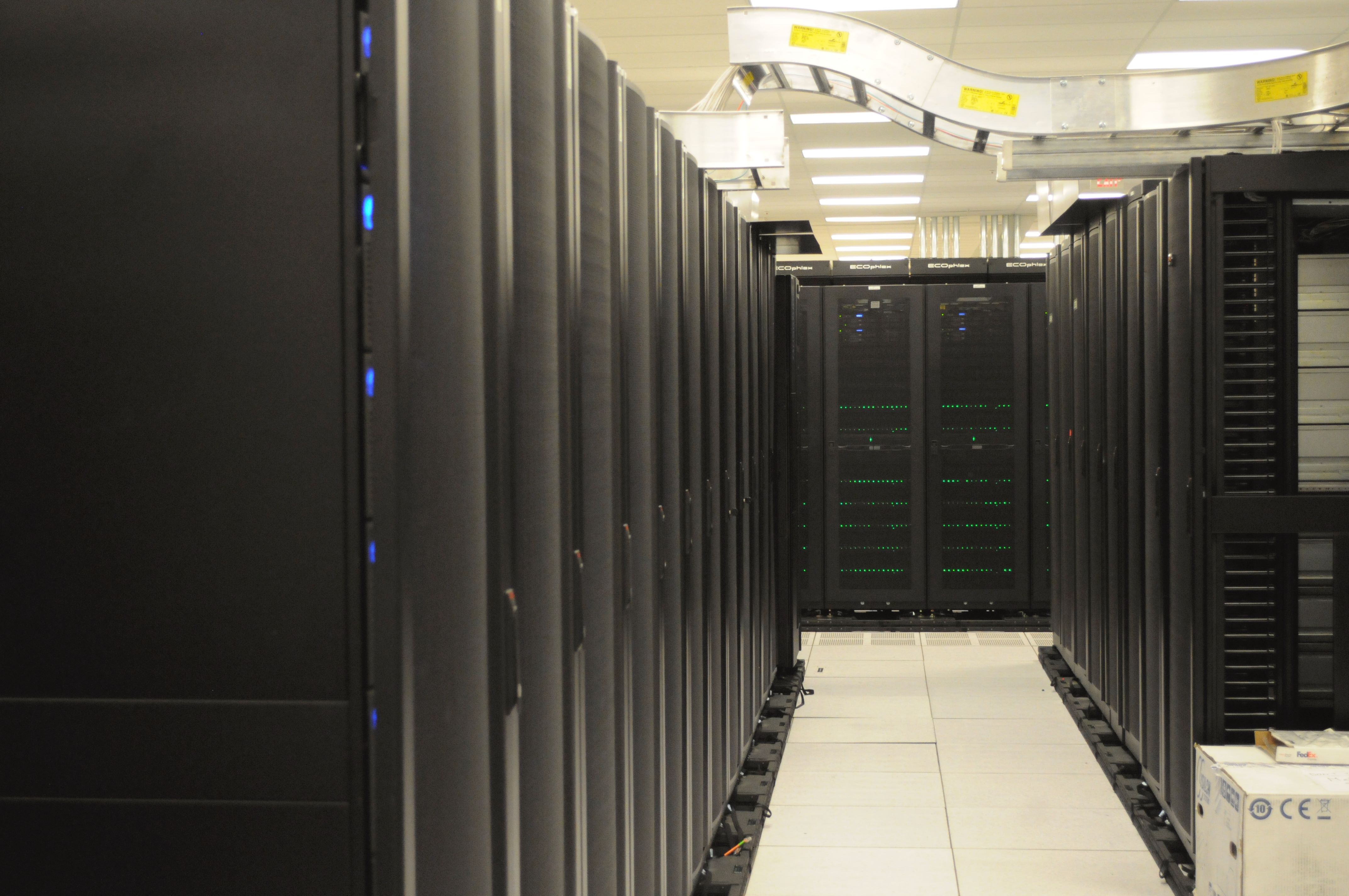 Server racks in a computing facility, used as a visual metaphor for CI infrastructure.